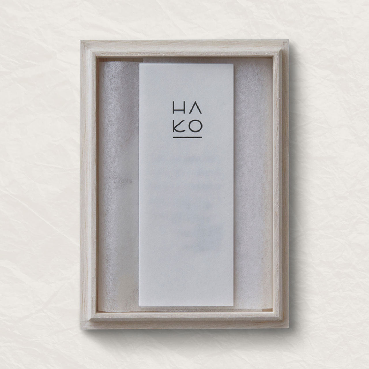 Wooden box with a white card