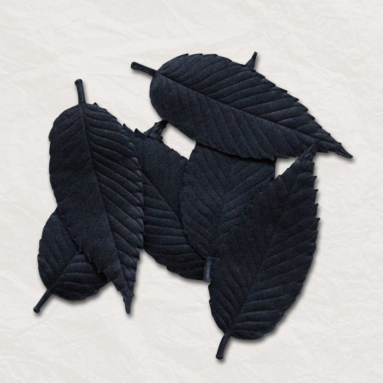 Black incense shaped like leaves